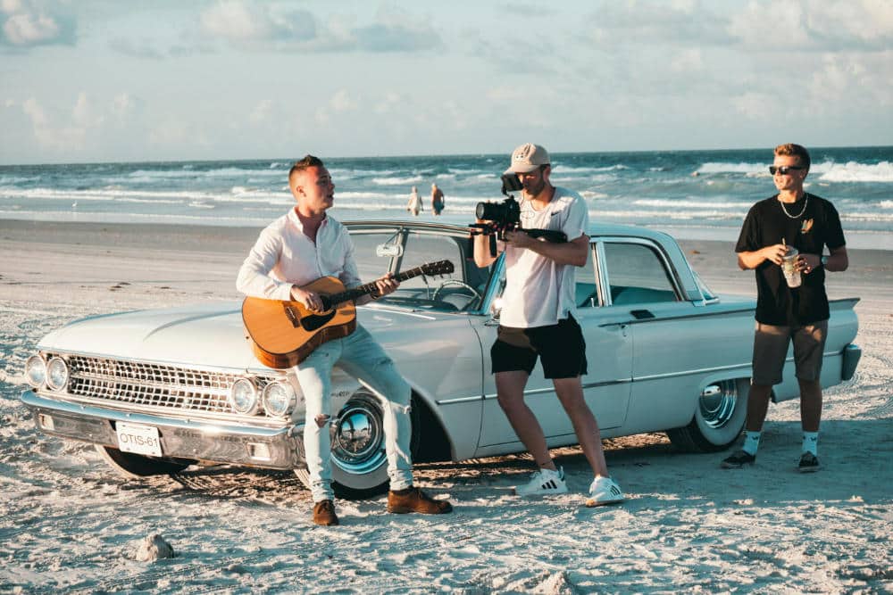 a music video is recorded on the beach