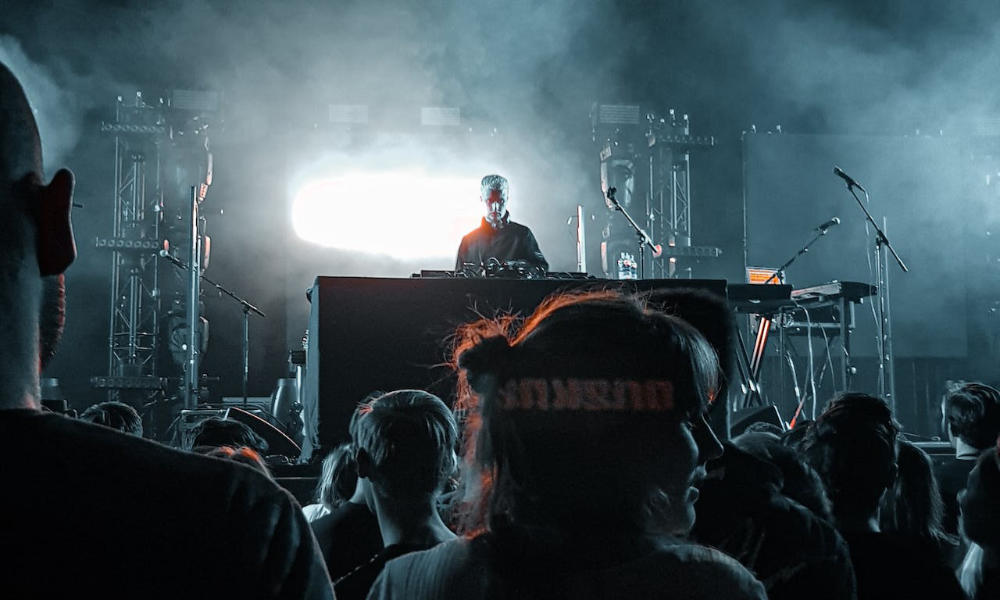 DJ Playing Techno Music on Festival Stage