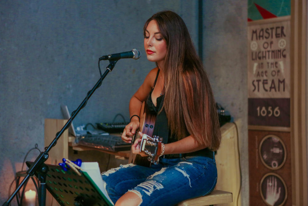 female singer with guitar