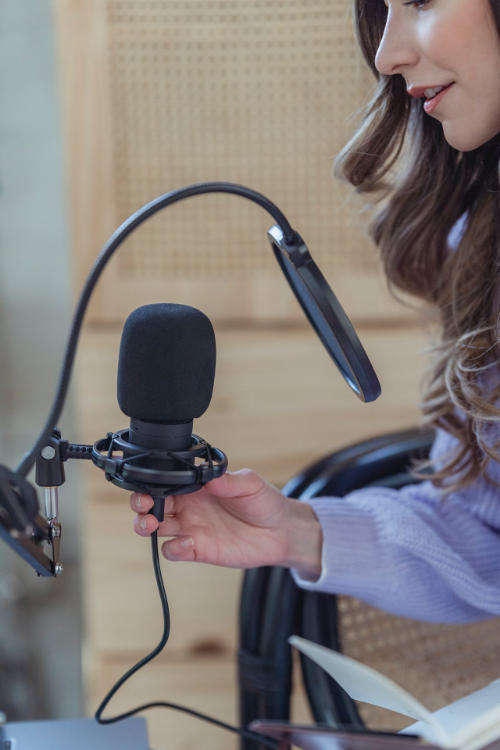 Female Singer with Microphone in Music Studio