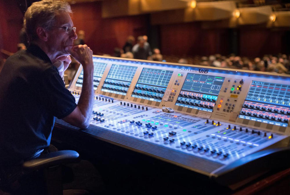 Man Sitting at the Mixing Desk Soundcraft Vi6