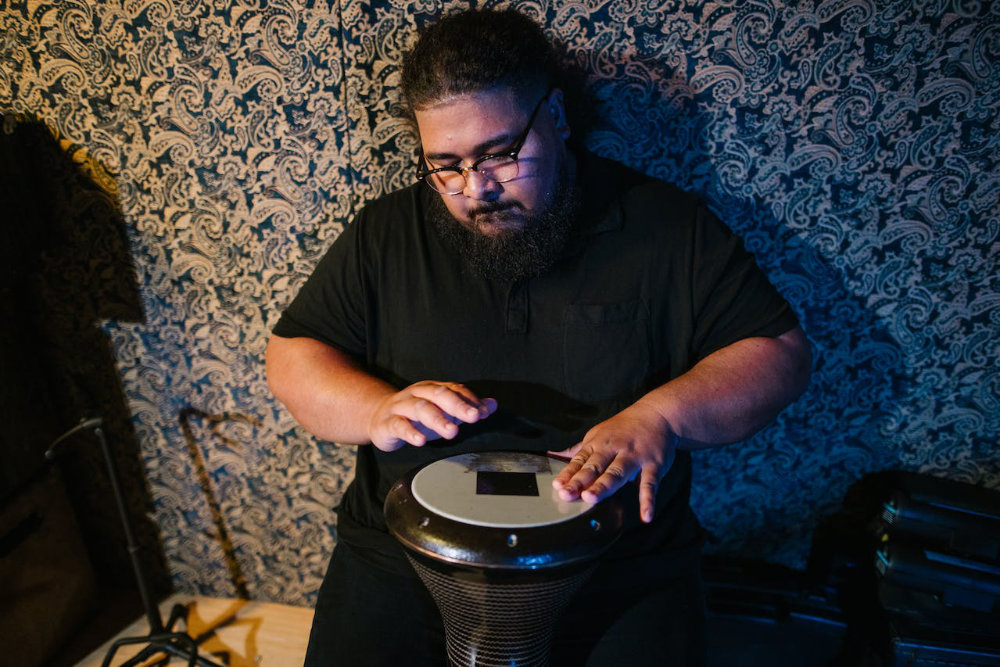 musician plays on a drum